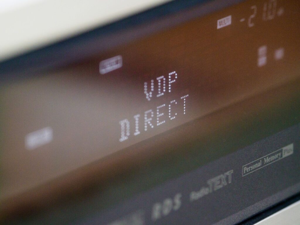 Extreme close-up of a digital screen displaying VDP DIRECT text with a soft focus.